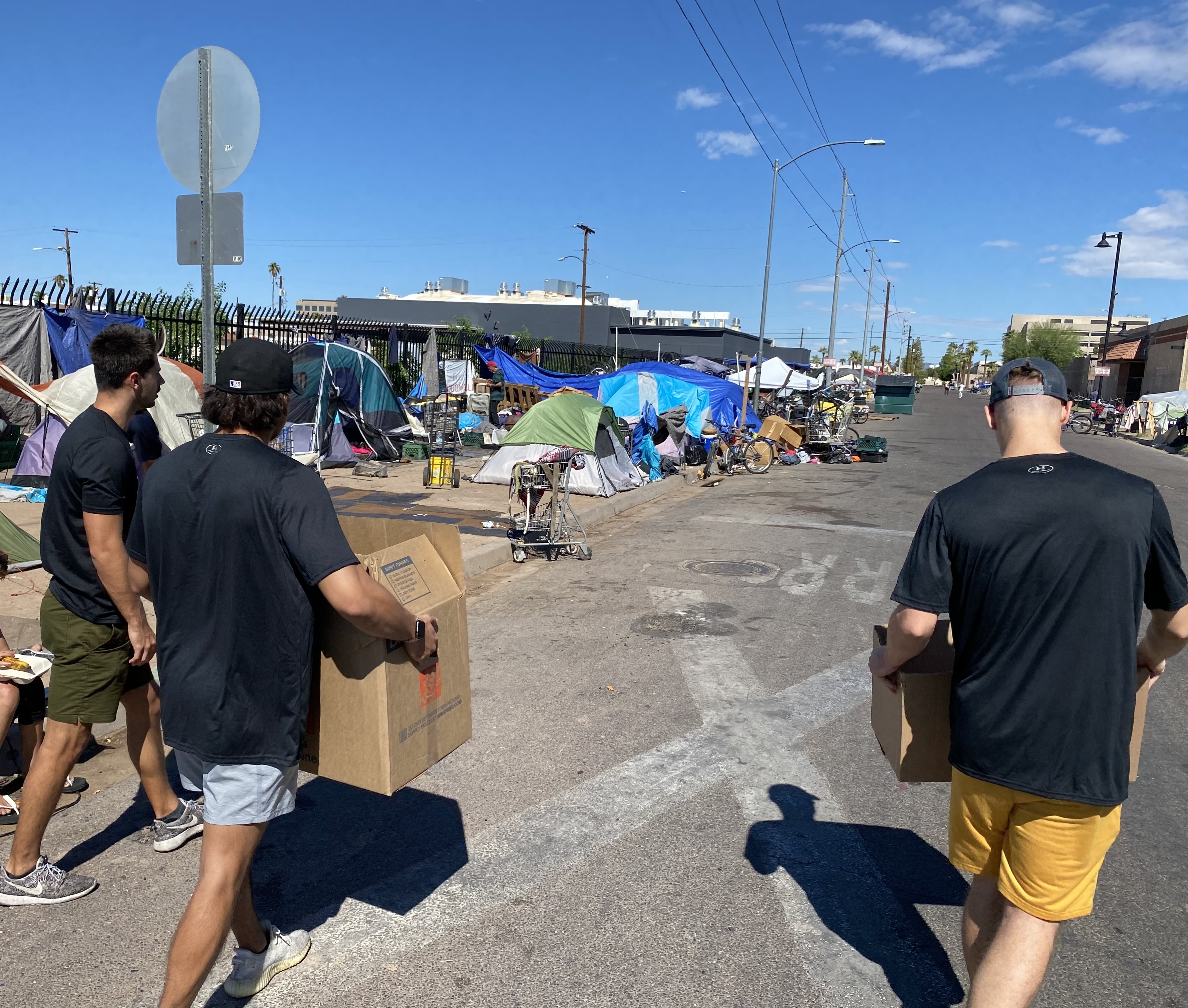 Zone 7 volunteers and community members at an outdoor health outreach event